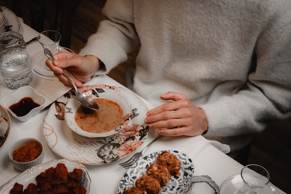 Person eating a soft, comfortable meal at home, a practical part of living with trigeminal neuralgia and managing food-related pain triggers