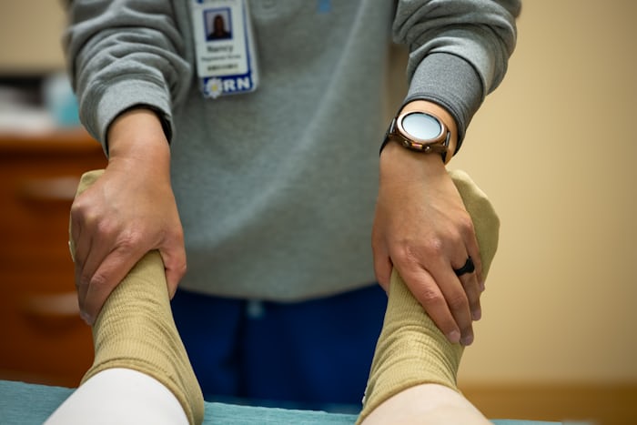 Physical therapist working with a patient, representing slip disc treatment without surgery through physiotherapy